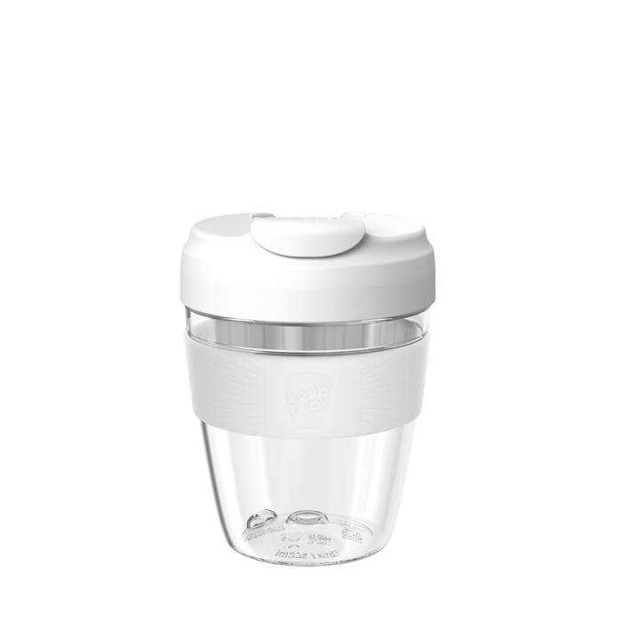 KeepCup Design Your Own Commuter Light reusable coffee cup in white, featuring a clear lightweight plastic body, white silicone band, and white lid with flip-top closure, shown against a plain white background.