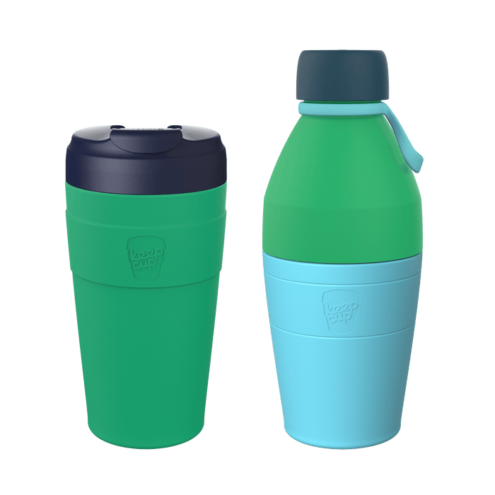 KeepCup Deskside Warrior set in Emerald Cloud, featuring a green reusable coffee cup with dark navy lid alongside a matching water bottle with green and light blue body, shown against a white background.