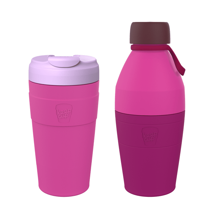 KeepCup Deskside Warrior set in Grenache colour, featuring a pink reusable coffee cup with lavender lid alongside a matching pink and magenta water bottle with burgundy cap and carry strap, displayed against a white background.