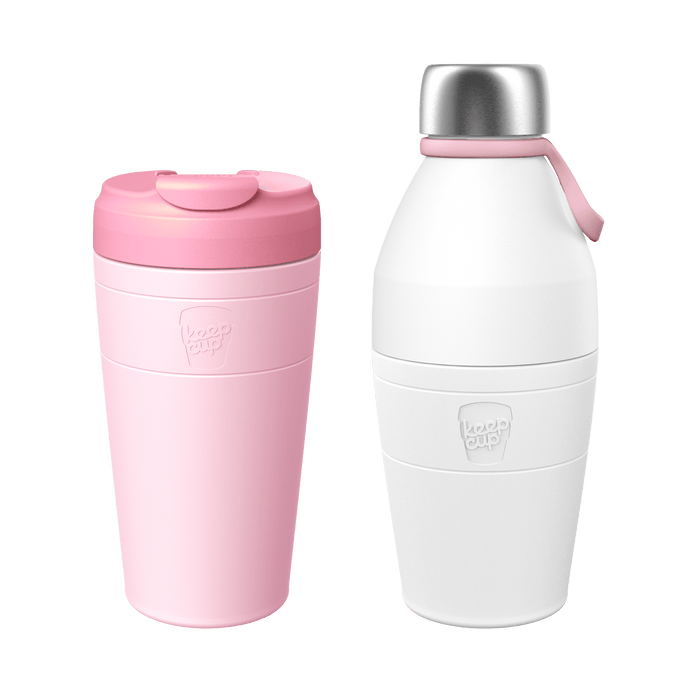 KeepCup Deskside Warrior Pashmak set featuring a pink reusable travel cup with flip-top lid alongside a white insulated bottle with stainless steel cap and pink carry loop, shown against a white background.