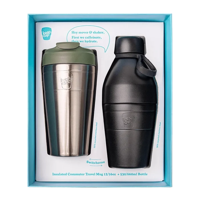 KeepCup Deskside Warrior gift set in Pine Black, featuring a stainless steel insulated commuter travel mug with olive green lid alongside a black stainless steel bottle, displayed in turquoise branded packaging with the tagline "First we caffeinate, then we hydrate.
