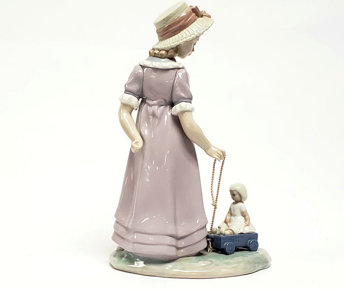 Girl With Toy Wagon, Retired Porcelain Figurine by Lladro 1978