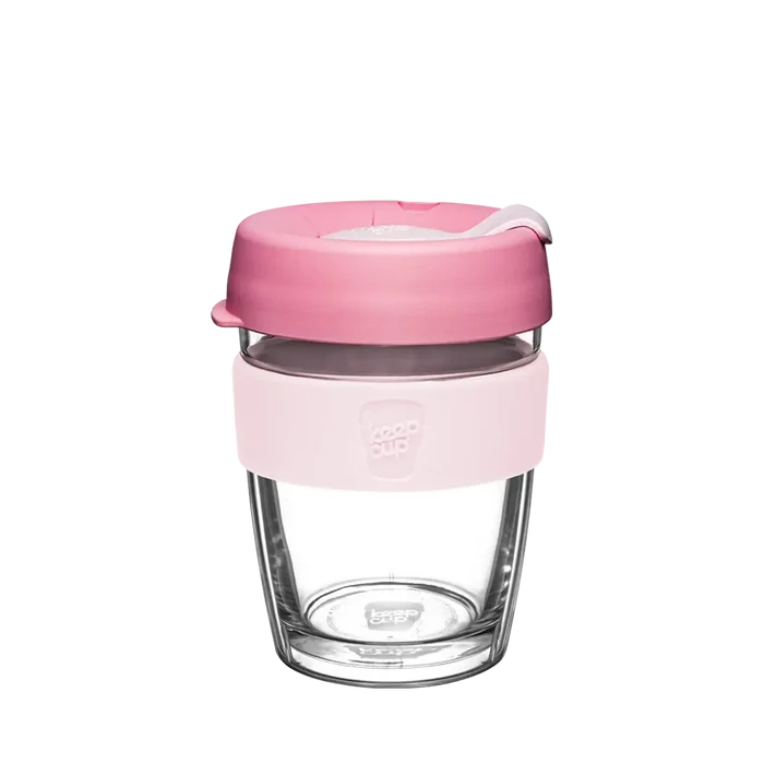 KeepCup Brew Longplay M 12oz in Pashmak Pink, featuring a clear double-walled glass body, light pink silicone band with embossed logo, and dusty rose-coloured lid with sipper closure, shown against a white background.