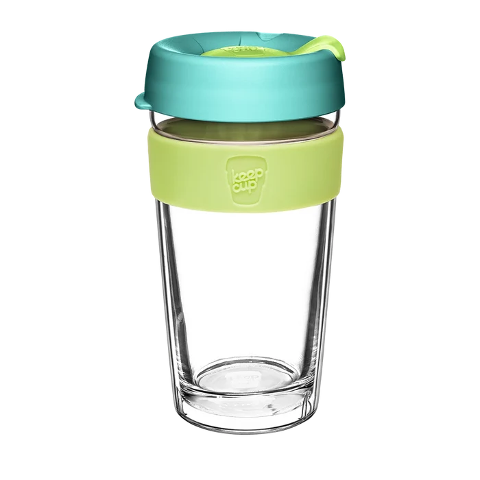 KeepCup Brew Longplay L 16oz in Matcha, featuring a clear double-walled glass cup with a lime green silicone band and teal lid with yellow plug, shown against a white background.