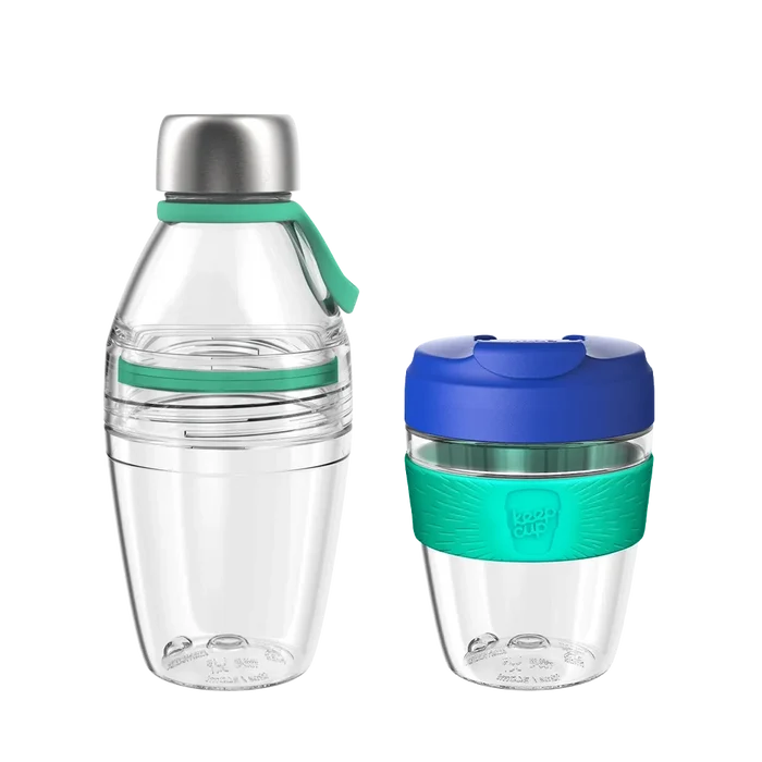 KeepCup Glow Getter Electric Frost set featuring a clear reusable water bottle with stainless steel cap and teal silicone accents alongside a matching reusable coffee cup with navy blue lid and teal band, shown against a white background.