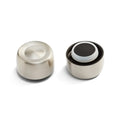 Two Helix Bottle Cap components in Chrome finish shown side by side – one displaying the brushed stainless steel exterior with concave top, the other revealing the interior with black and white silicone sealing rings.