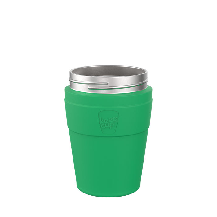 KeepCup Helix Base with Band in Emerald, M 12oz, shown from a front angle against a white background. The reusable cup features a vibrant green band and base with an embossed KeepCup logo, topped with a stainless steel rim.