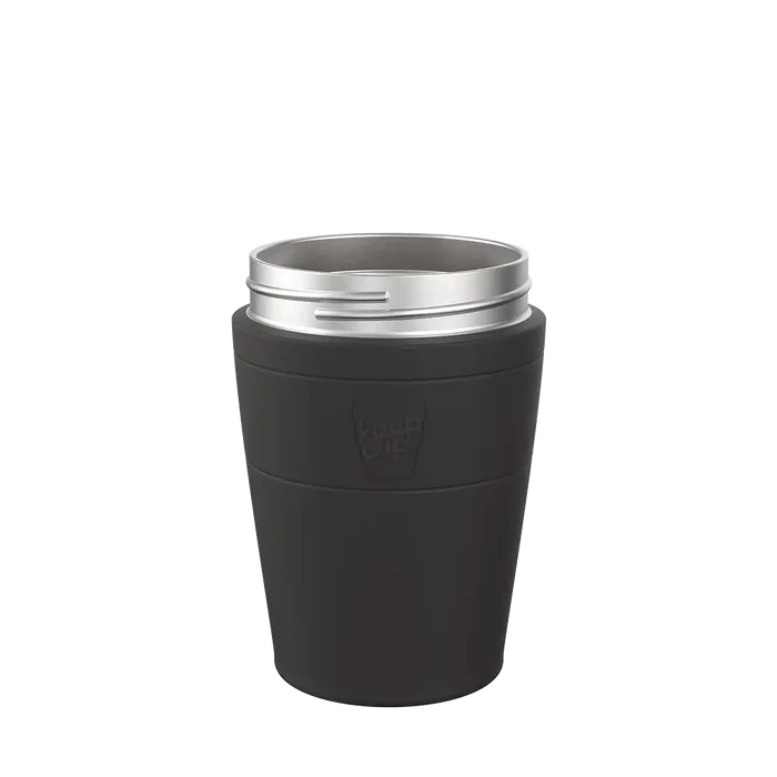 KeepCup Helix Stainless Steel Base in Black, M 12oz size, shown from a front angle against a plain white background, featuring a dark charcoal exterior with embossed KeepCup logo and silver stainless steel rim.