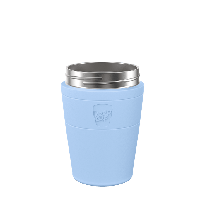 KeepCup Helix Stainless Steel Cup Base in light blue, shown from a front angle against a white background, featuring the embossed KeepCup logo on the band and a stainless steel rim at the top.