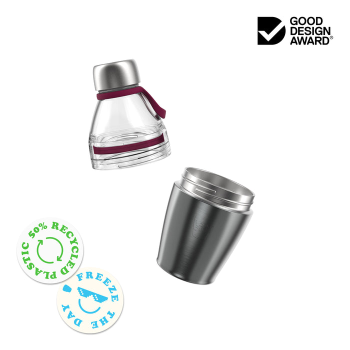 KeepCup Helix Bottle Clear Top 420ml shown as an exploded view with the clear plastic top section featuring burgundy silicone bands and stainless steel cap separated from the black stainless steel base cup. Badges highlight 50% recycled plastic and freezer-safe features, alongside a Good Design Award logo.