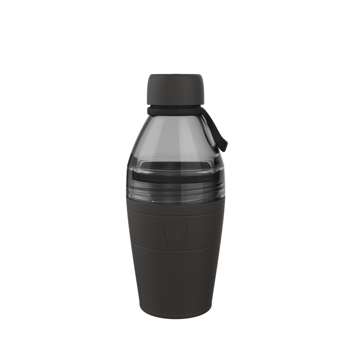 KeepCup Helix Bottle Clear Top 530ml in Black, shown in a front-facing product shot against a white background, featuring a dark grey silicone grip sleeve on the lower portion, transparent grey upper section, and black screw-top lid with carry loop.