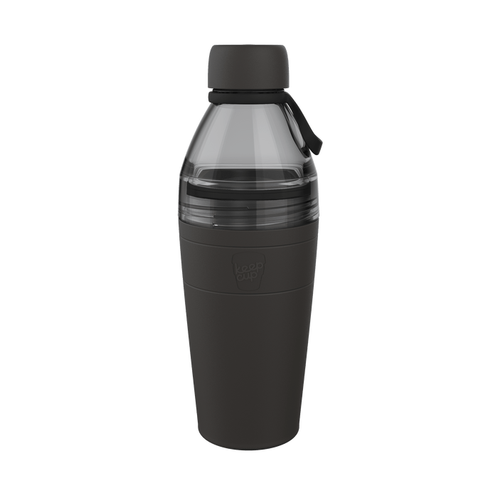 KeepCup Helix Bottle Clear Top 660ml in Black, shown from a front angle against a white background, featuring a transparent smoked upper section with carry loop and a matte black silicone sleeve on the lower portion with embossed KeepCup logo.