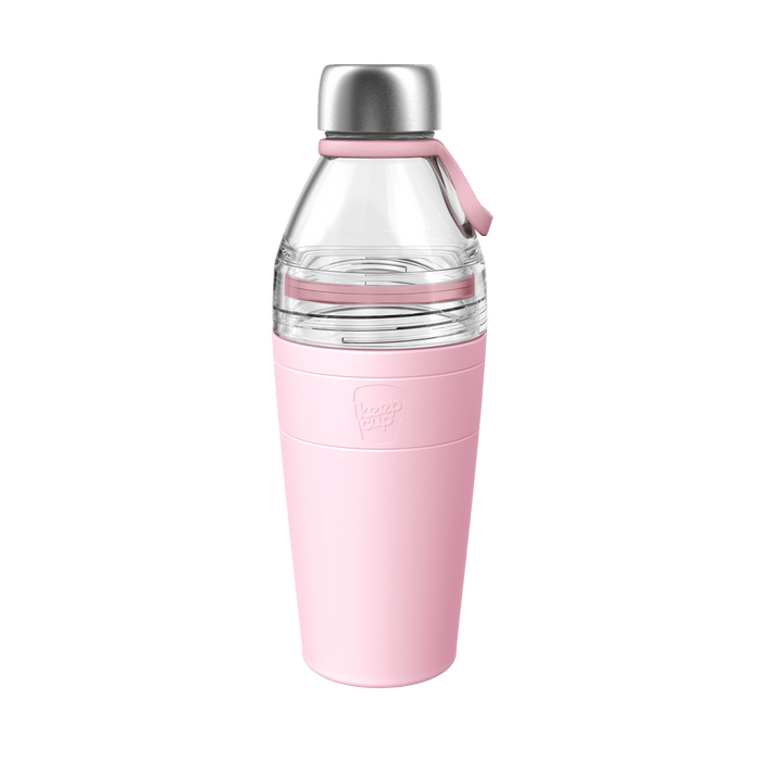 KeepCup Helix Bottle Clear Top 660ml in Pashmak Pink, featuring a clear glass upper section with stainless steel cap, pink silicone carry loop, and soft pink insulated base with embossed KeepCup logo, shown against a white background.