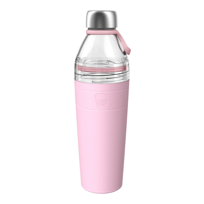 KeepCup Helix Bottle Clear Top 770ml in Pashmak Pink, shown at a front angle against a white background, featuring a clear Tritan upper section, soft pink silicone sleeve with embossed KeepCup logo, stainless steel cap, and matching pink carry loop.