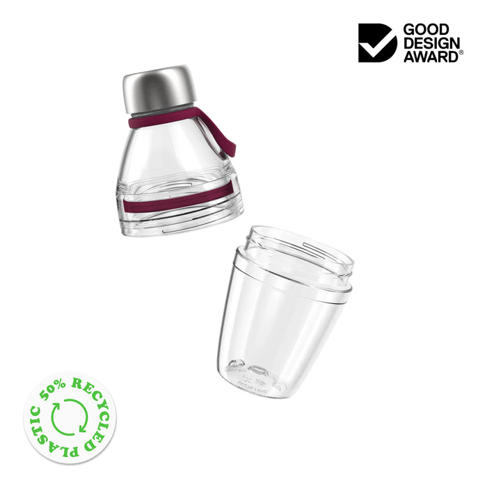 Exploded view of the KeepCup Helix Light Bottle 530ml showing the two main components separated: the clear Tritan body with silver stainless steel cap and silicone carry strap, alongside the detachable clear base cup. Features Good Design Award logo and 50% recycled plastic certification badge.
