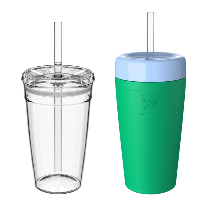 Two KeepCup Iced Latte Lover cups shown side by side against a white background: the left displays the clear double-walled cup with transparent lid and reusable straw, while the right shows the same cup with the Emerald green silicone sleeve and pale blue lid attached.