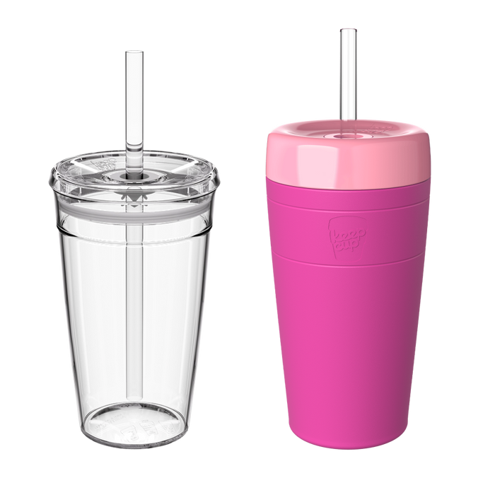 Two KeepCup Iced Latte Lover reusable cups with plastic straws shown side by side against a white background: a clear transparent cup on the left and the Fuchsia colourway on the right, featuring a vibrant pink body with a lighter pink lid.