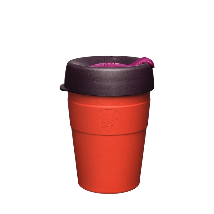 KeepCup Thermal M 12oz in Ginger, featuring a warm orange double-walled stainless steel cup with a dark plum lid and magenta sipper plug, shown against a plain white background.