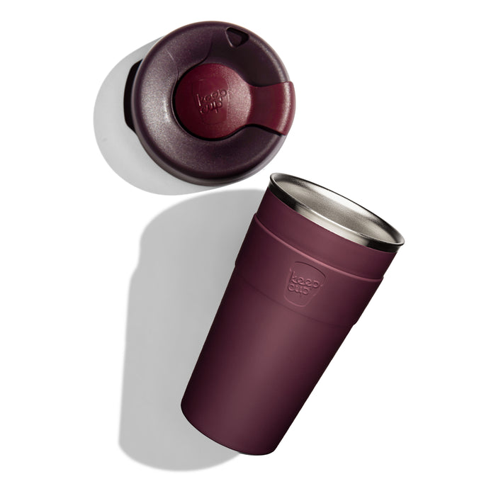 KeepCup Thermal L 16oz shown from above with the lid separated to display the sipper closure, alongside the stainless steel cup featuring a matte exterior and embossed KeepCup logo.