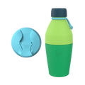 KeepCup Just Essentials in Emerald reusable bottle featuring a two-tone green body with dark navy cap and light blue carry loop, shown alongside a matching light blue sipper lid displaying the KeepCup logo.