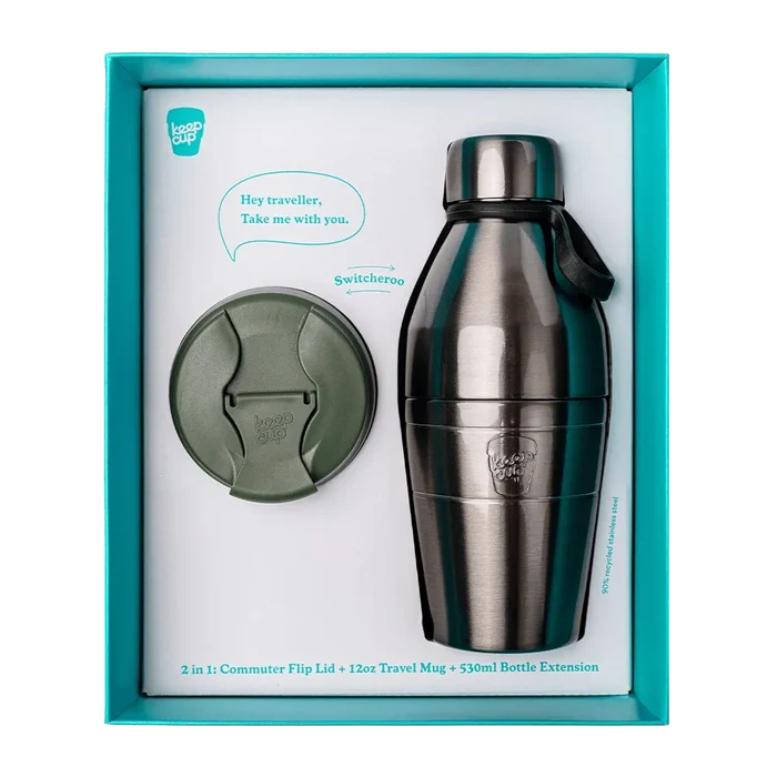KeepCup Just Essentials Pine gift set in teal packaging, featuring a stainless steel 2-in-1 bottle with 12oz travel mug and 530ml bottle extension, alongside an olive green commuter flip lid, made from 90% recycled stainless steel.