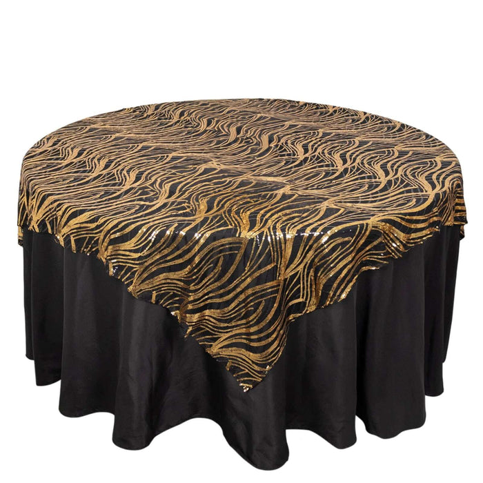 Gold and black wave pattern table cover on a round table.