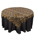 Gold and black wave pattern table cover on a round table.