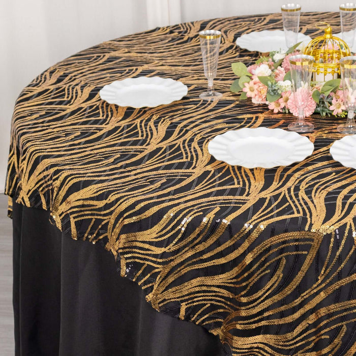 Elegant gold and black tablecloth with wavy design for stylish dining setups.