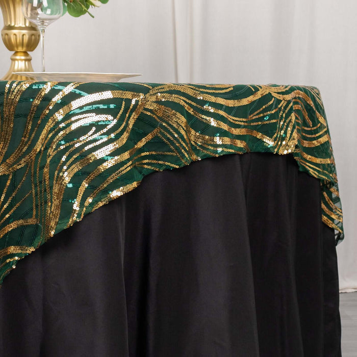 Elegant green and gold sequined tablecloth draping over a black table.