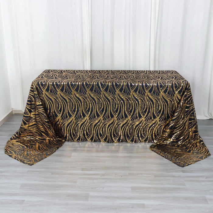 Black and gold sequined tablecloth with a wave pattern.