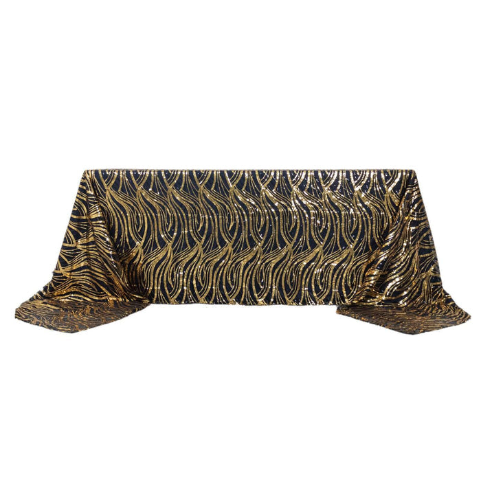 Black and gold patterned tablecloth with flowing design