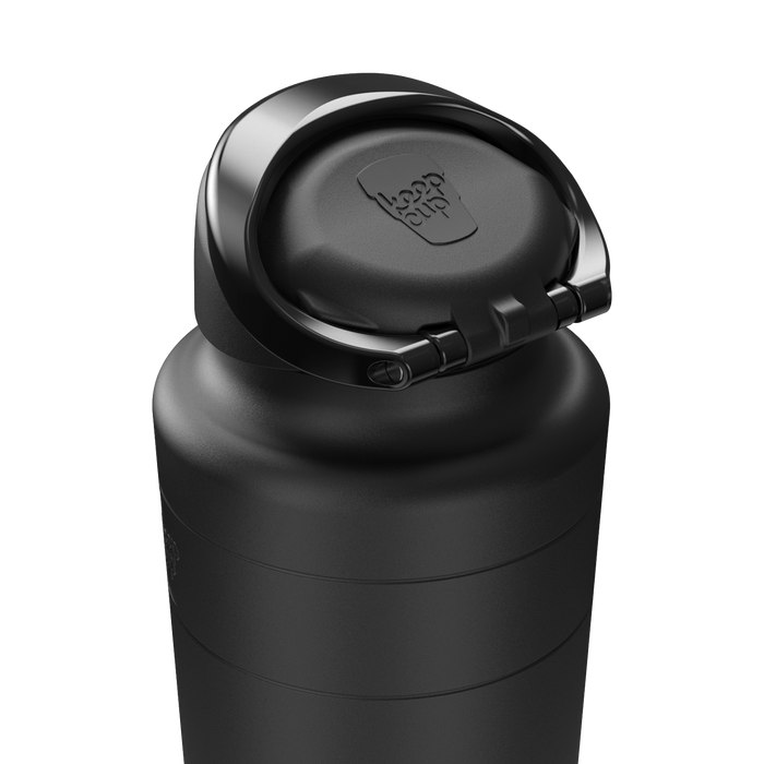 Close-up view of the Ora Bottle 950ml in Black, showing the flip-top lid open with the KeepCup logo embossed on the inner cap, highlighting the sleek matte black finish and hinged drinking spout design.
