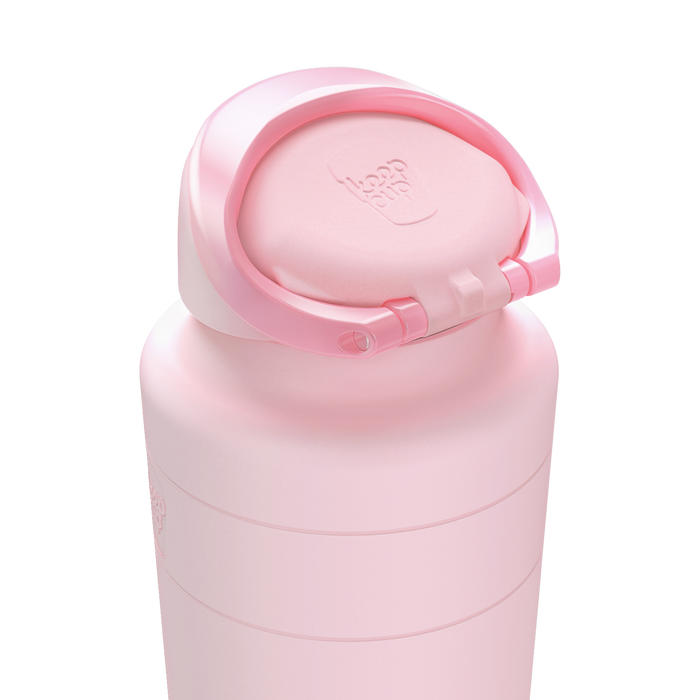 Close-up of the Ora Bottle 700ml in Pashmak Pink showing the flip-top lid open, highlighting the embossed KeepCup logo on the lid and the soft matte finish of the reusable bottle.