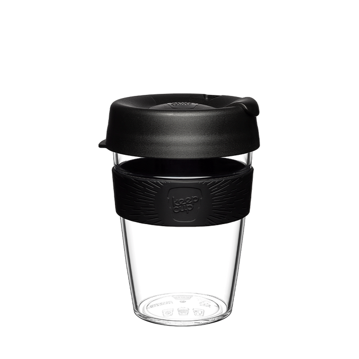 KeepCup Original Clear M 12oz in Black, featuring a clear reusable plastic cup with black silicone band and black lid with sipper closure, shown against a white background.