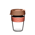 KeepCup Original Clear M 12oz in Frappe, featuring a clear reusable plastic cup with a coral-coloured silicone band embossed with the KeepCup logo, and a matte brown lid with peach-toned sipper, shown against a white background.