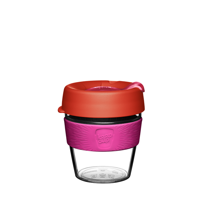 KeepCup Original Clear S 8oz in Daybreak, featuring a clear plastic cup with pink silicone band and coral-coloured lid with sipper opening, shown against a white background.