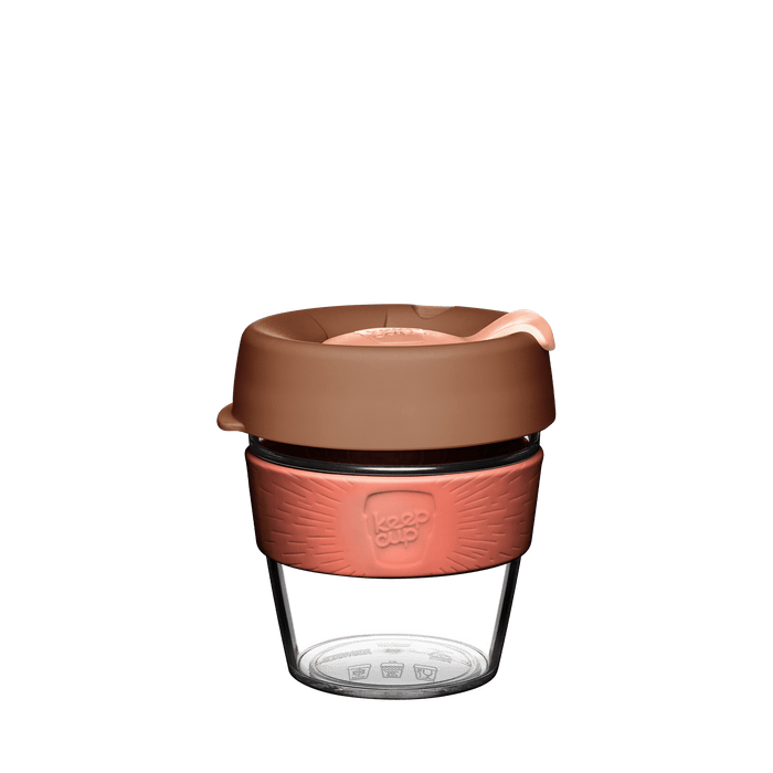 KeepCup Original Clear S 8oz in Frappe, featuring a clear tritan cup with coral-coloured silicone band, brown lid with peach-toned plug, shown against a white background.