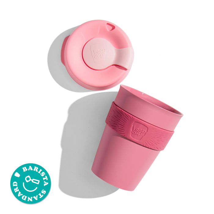 KeepCup Original M 12oz shown from above with the lid separated from the cup, featuring a silicone band with the KeepCup logo and a Barista Standard certification badge in the corner.