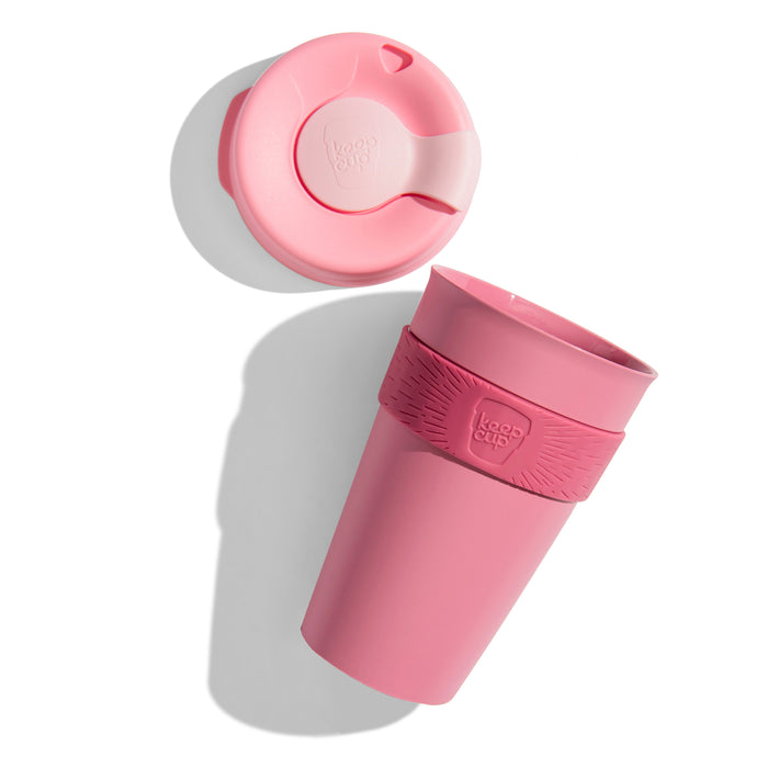 KeepCup Original L 16oz shown as an exploded view with the lid separated from the cup body, featuring a silicone band with the KeepCup logo, photographed from above at an angle against a white background.