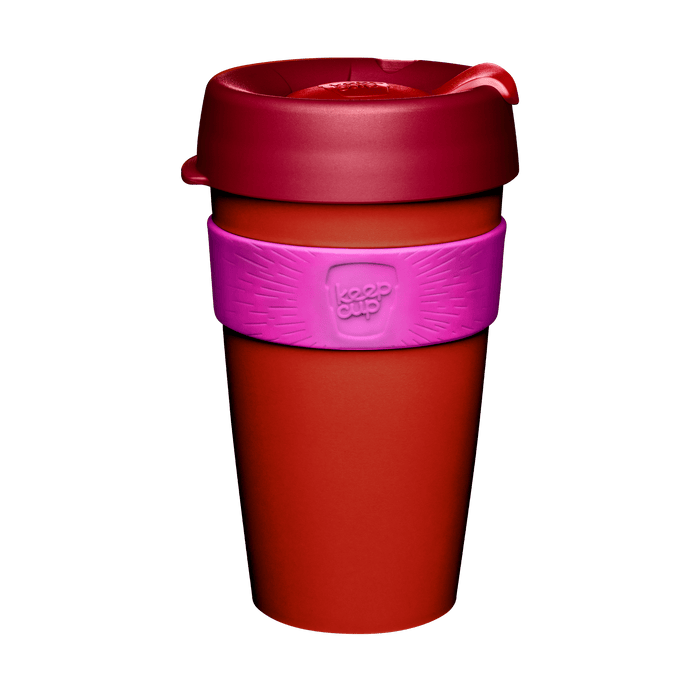 KeepCup Original L 16oz in Daybreak, featuring a burnt orange cup body, dark red lid with sipper closure, and pink silicone band, shown against a white background.