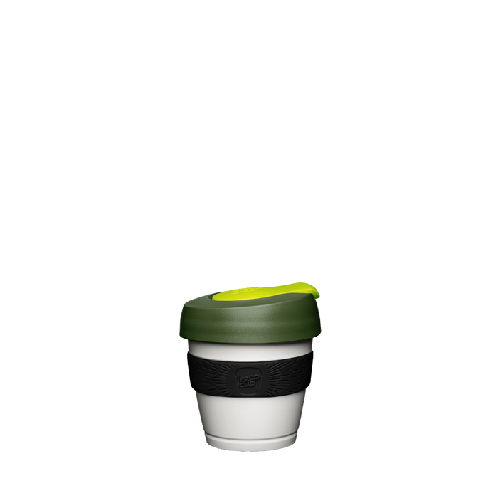 KeepCup Original XXS 4oz in Pine, featuring a white reusable cup with dark green lid, bright yellow sip hole plug, and black silicone band with embossed KeepCup logo, shown against a plain white background.