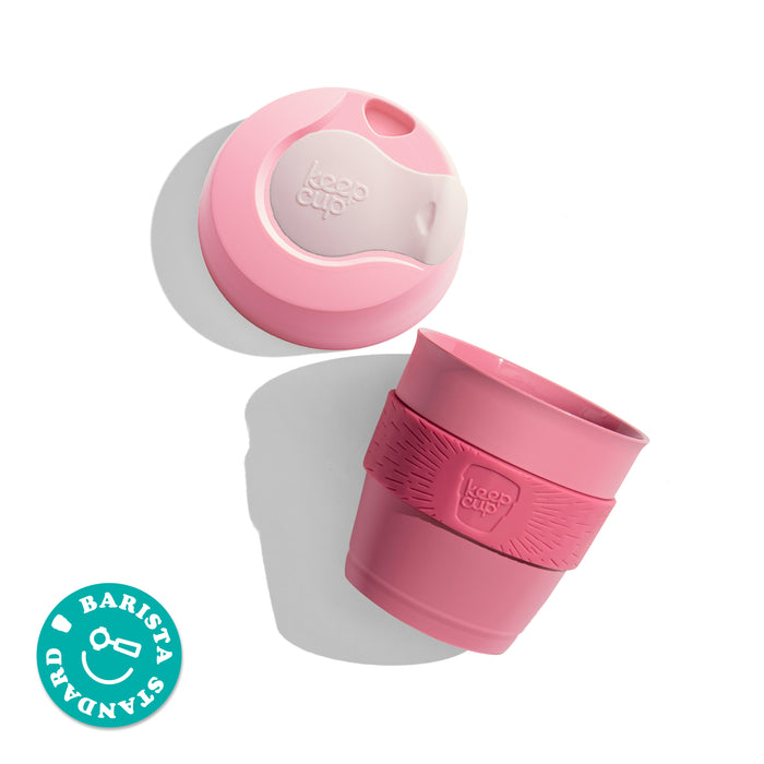 KeepCup Original XXS 4oz shown from above with the lid separated from the cup, featuring a silicone band with embossed KeepCup logo. Barista Standard certification badge displayed in corner.
