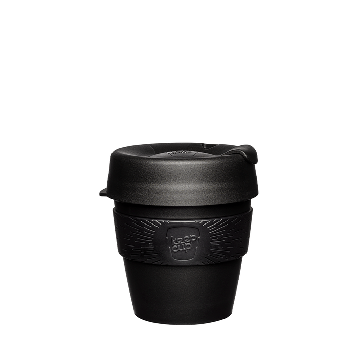 KeepCup Original S 8oz in Black, featuring an all-black reusable coffee cup with plastic body, silicone band embossed with the KeepCup logo, and press-fit lid with sipper opening, shown against a white background.
