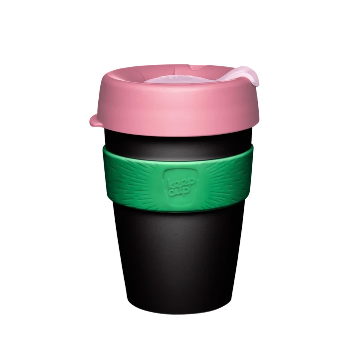 KeepCup Original M 12oz in Sorrel, featuring a black cup body with pink lid and green silicone band displaying the KeepCup logo, shown against a white background.