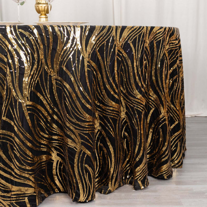 Gold and black sequin tablecloth with wavy patterns on a round table.