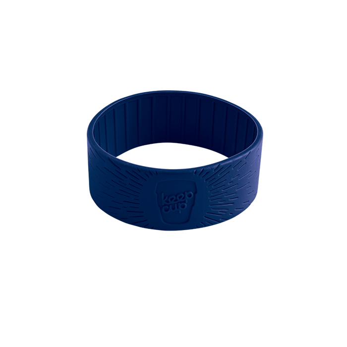 Navy silicone band for KeepCup in S/M/L size, shown at a slight angle on a white background, featuring the embossed KeepCup logo and radiating line texture on the exterior with vertical ridges on the interior.