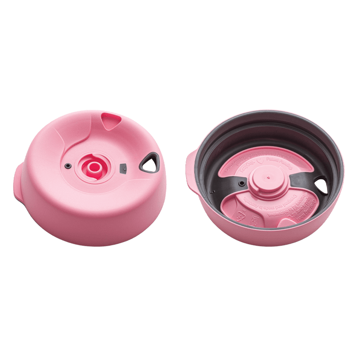 Splashproof Lid Base in pink shown from two angles: the top view displaying the central drinking spout and ventilation hole, and the underside view revealing the grey inner mechanism with pink rotating disc and product markings.
