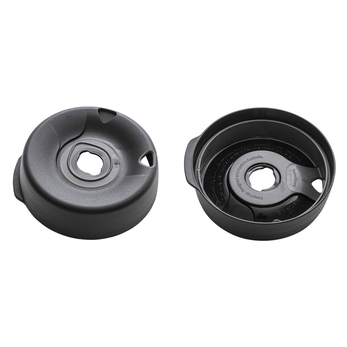 Splashproof Lid Base in Black shown from two angles: the top view displaying the drinking opening and splash-resistant design, and the underside revealing the internal mechanism with "KeepCup, designed and made in Australia" text visible.