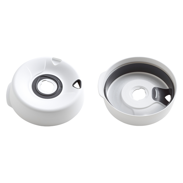 KeepCup Splashproof Lid Base in White shown from two angles: the top view displaying the central opening with grey silicone seal and triangular steam vents, and an interior view revealing the underside construction and how it fits within the cup rim.