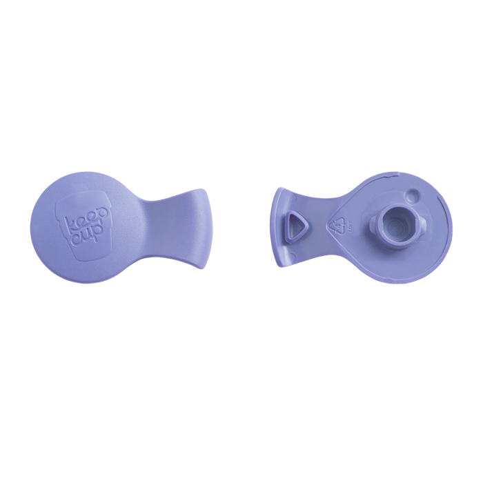 Top and bottom view of the KeepCup Splashproof Plug in Maeve, a soft lavender colour, showing the embossed KeepCup logo on the smooth upper surface and the underside with drinking spout and silicone seal.